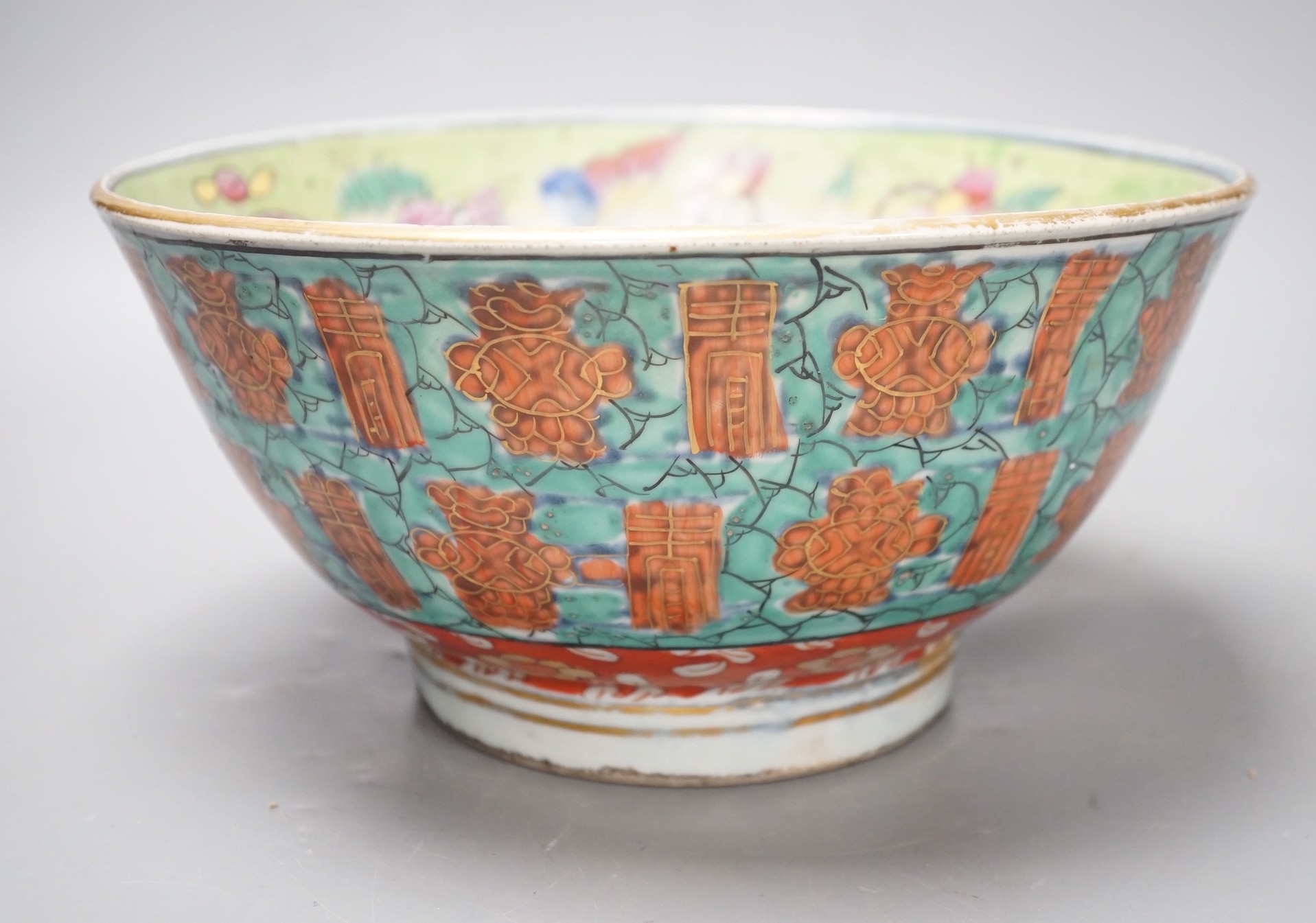 An 18th century clobbered Chinese or Japanese porcelain bowl, 24.5cm diameter